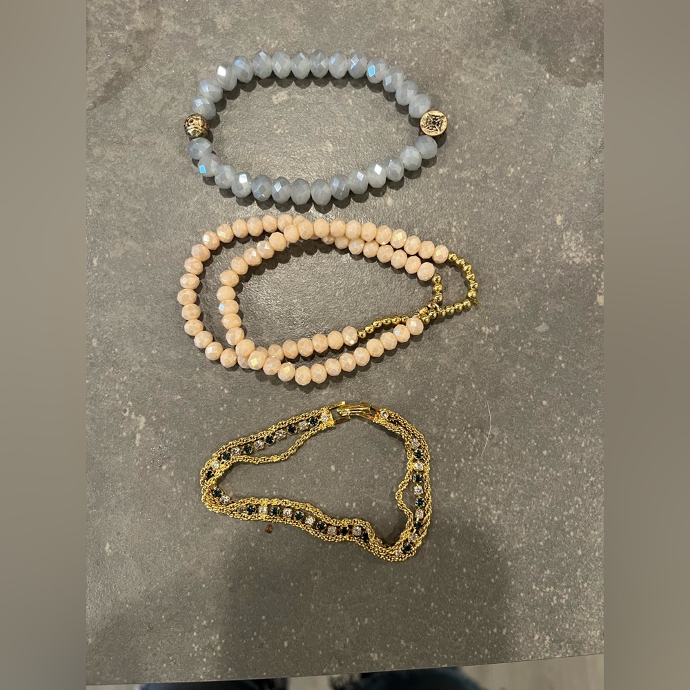 Lot of 3 bracelets. 2 are made of glass. The yellow tone bracelet is very shiny